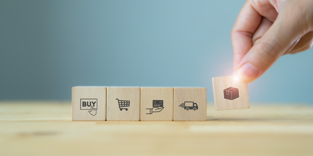 E-commerce,Online,Shopping,Concept,With,Ecosystem.,Customer's,Hand,Hold,Wood